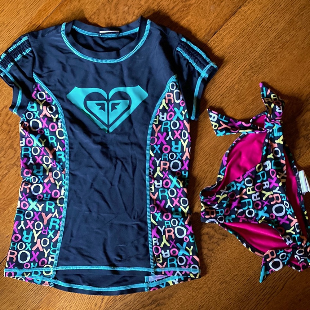 Girls size 7 Roxy Girl swim suit.  Separate bottoms and rash-guard top.